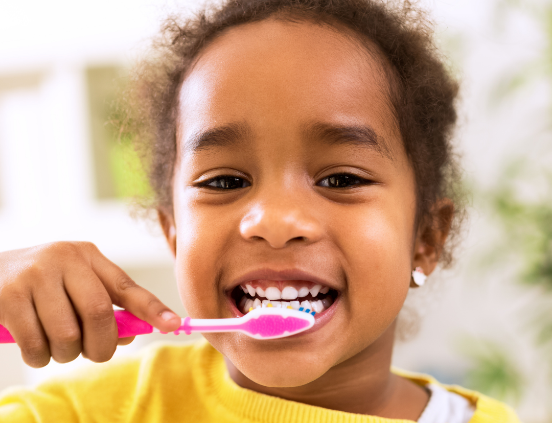 child brushing teeth